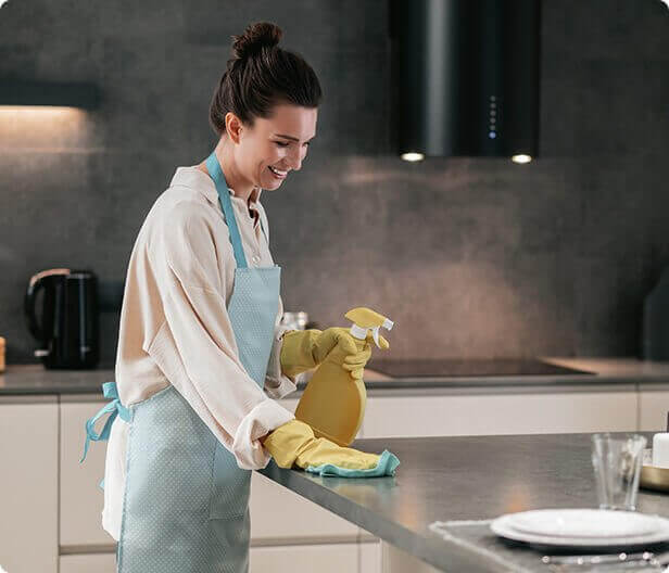 Woman cleaning worktop